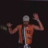 Runner crosses triathlon finish line