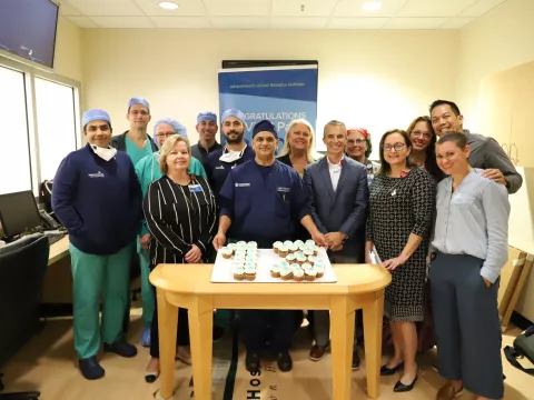 Dr. Vipul Patel and his team celebrating his milestone of 13,000 surgeries